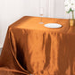 Cinnamon brown satin rectangular tablecloth on a dining table.