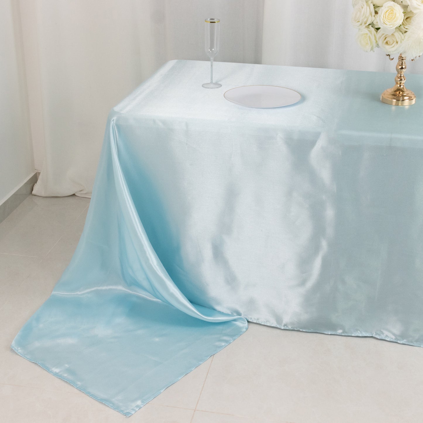 Light blue satin tablecloth for 8-foot table with floor-length drop.