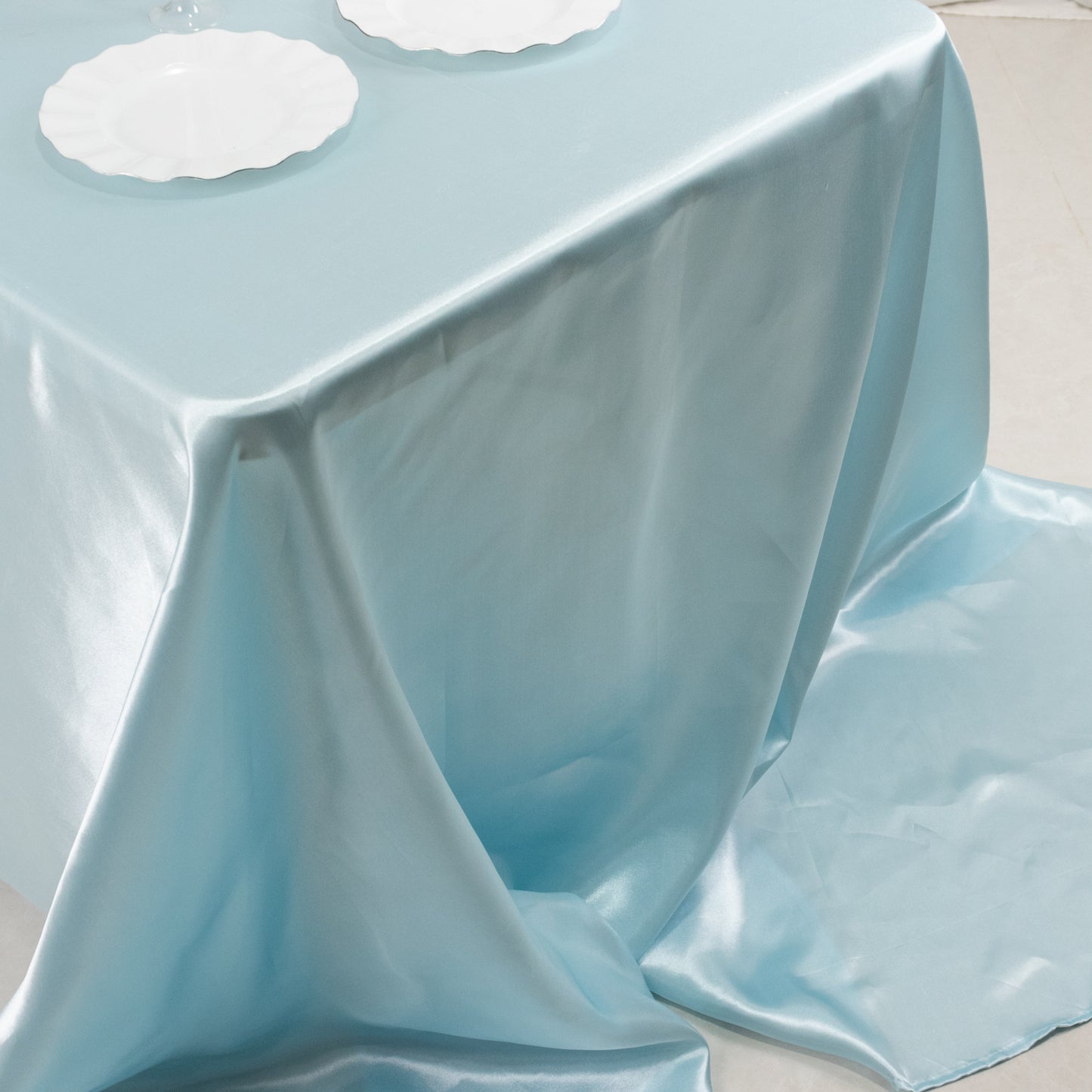 Light blue seamless satin tablecloth for 8-foot table with floor-length drop.