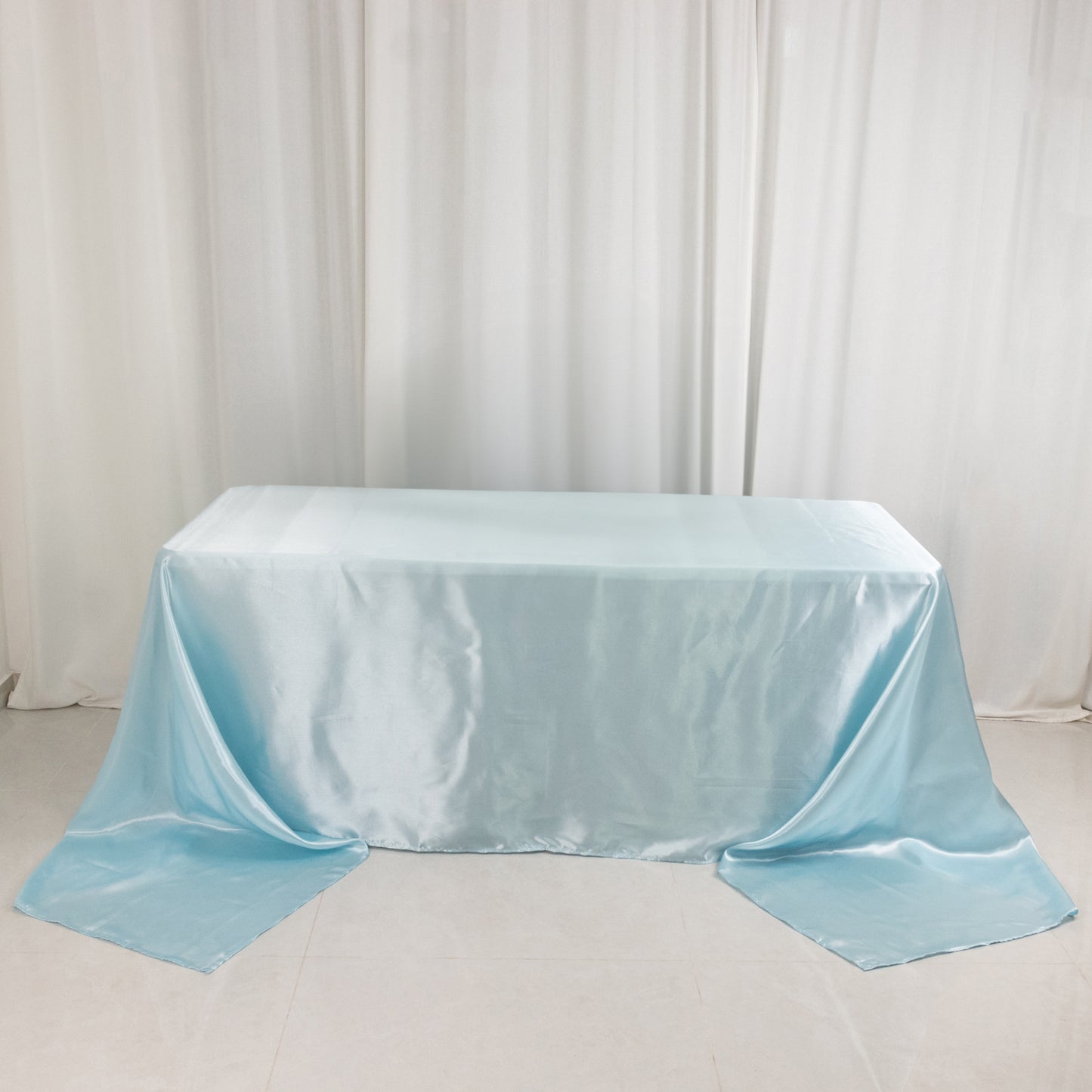 Light blue satin tablecloth for 8-foot table with floor-length drop.