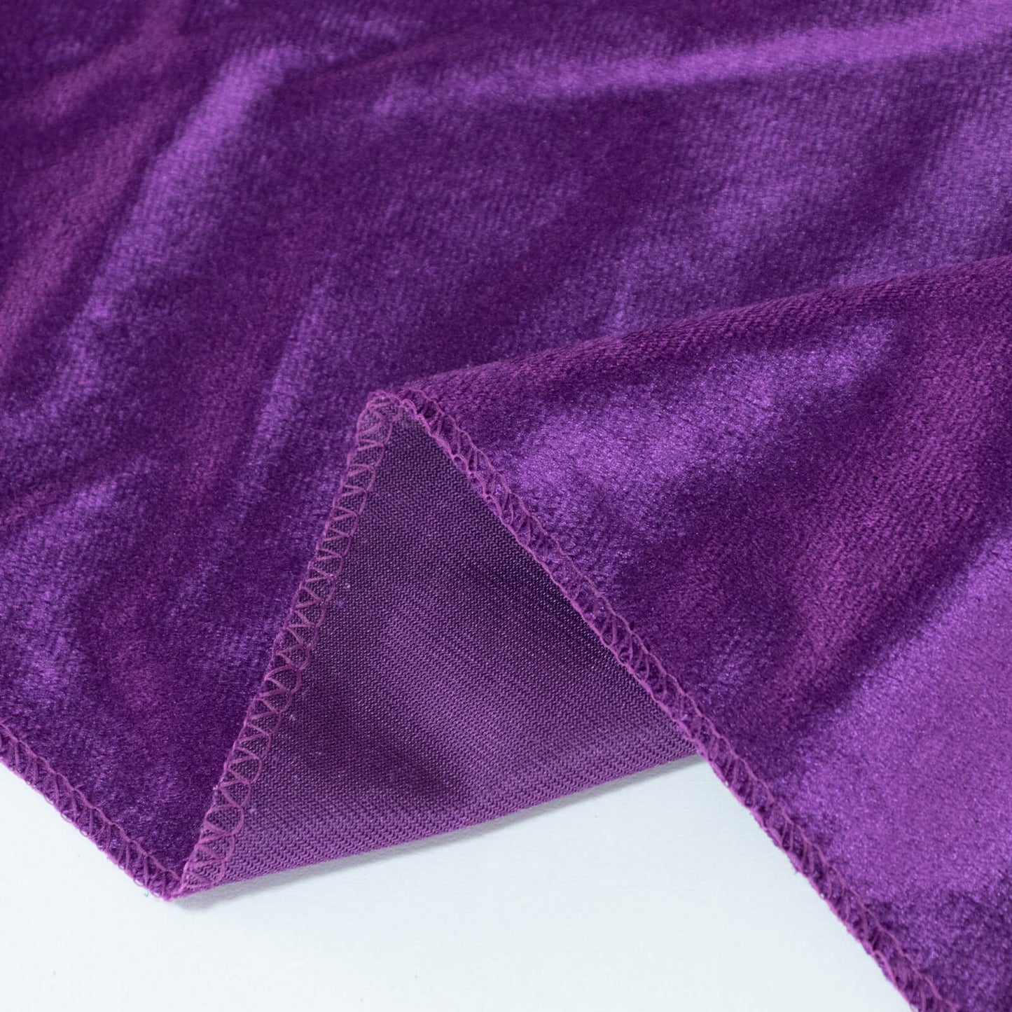 Premium velvet round tablecloth in rich purple color.