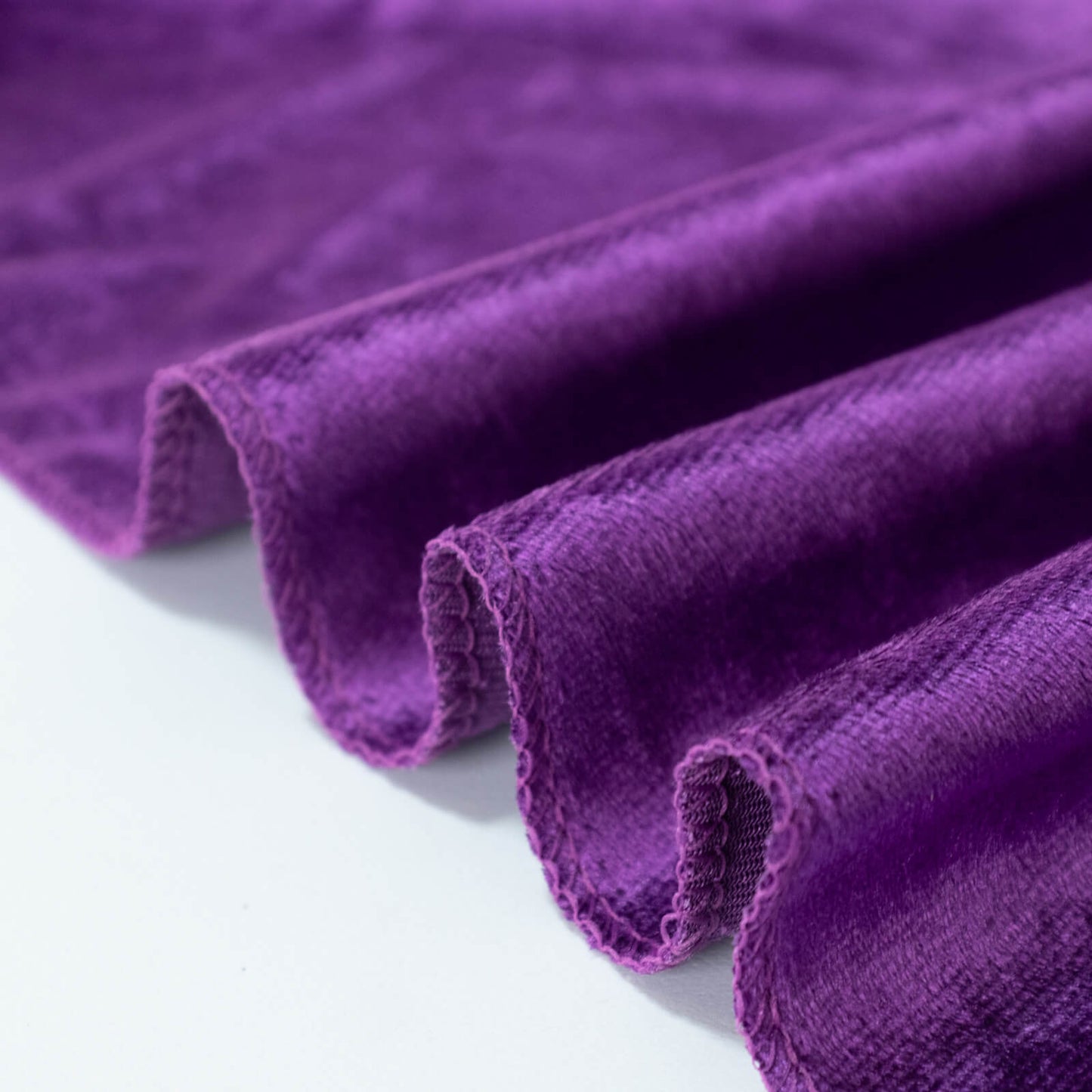 Premium purple velvet round tablecloth with soft texture and elegant drape.