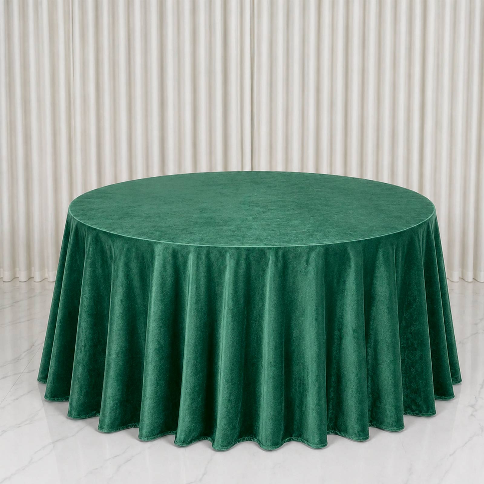 Premium velvet round tablecloth in hunter emerald green.