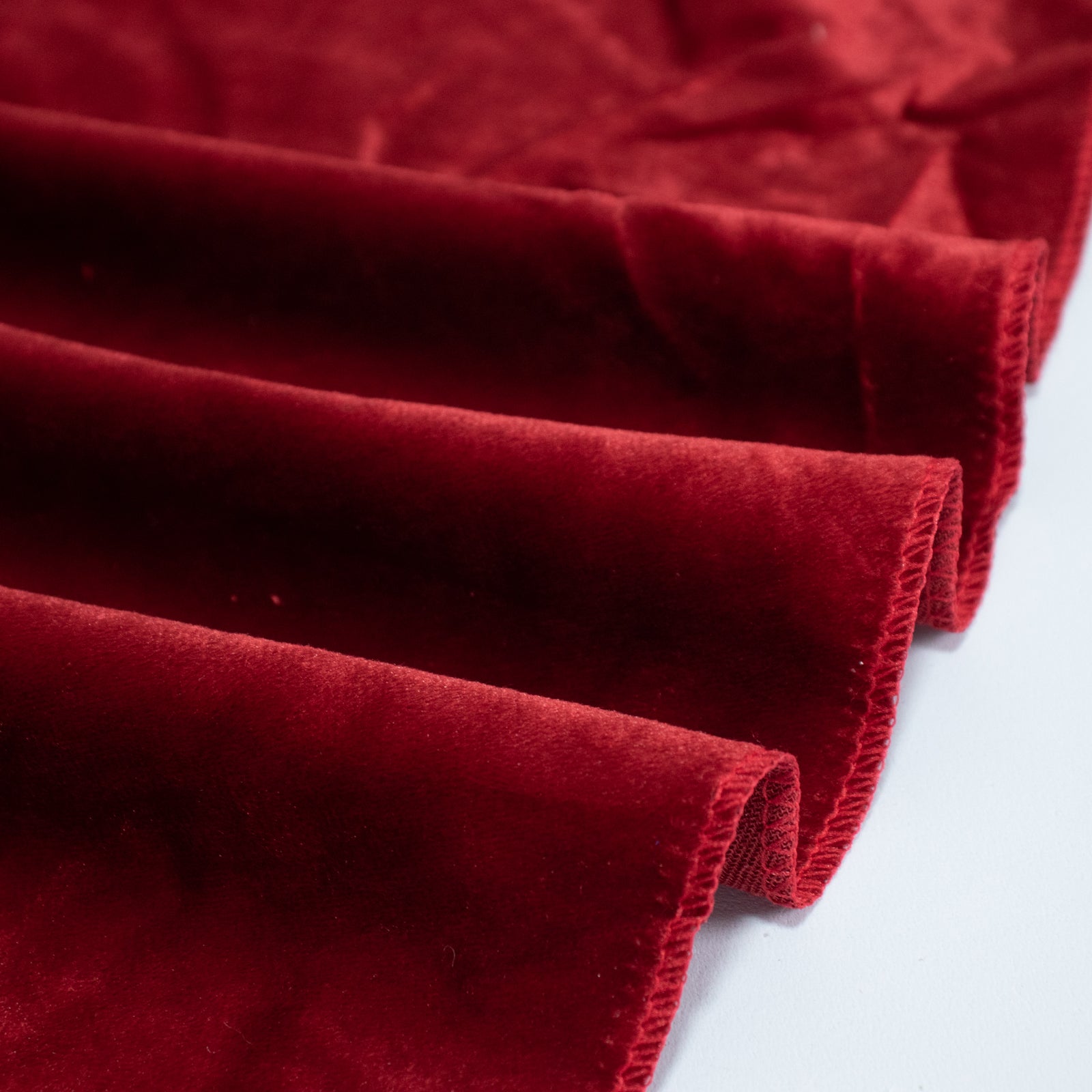 Red velvet round tablecloth, soft and seamless design.