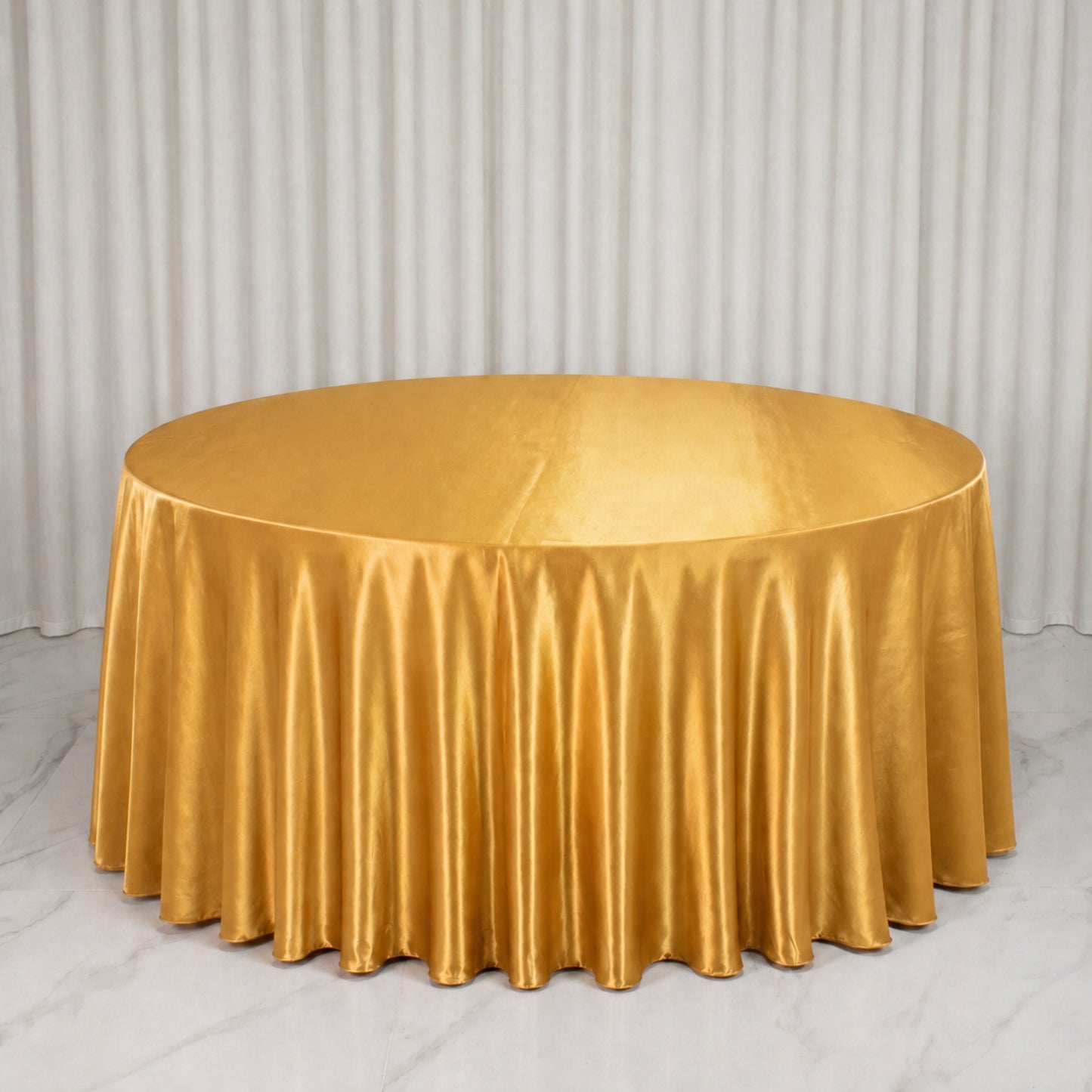 Premium velvet gold round tablecloth, soft and seamless cover for elegant dining.