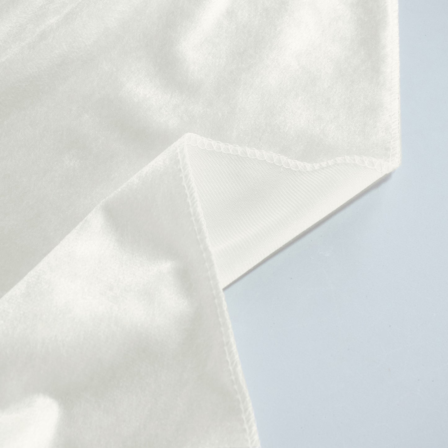 Ivory premium velvet round tablecloth, soft and seamless design.