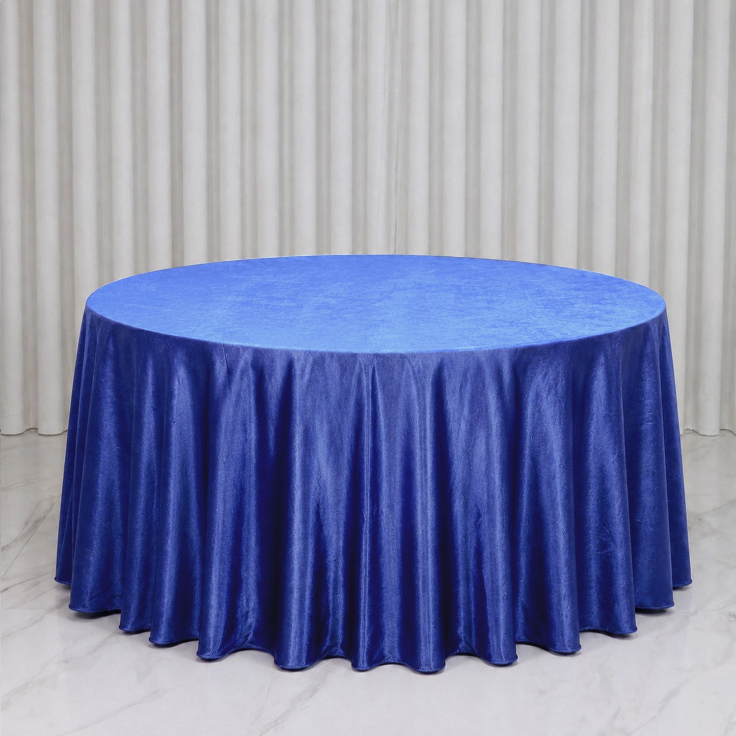 Premium Velvet Royal Blue Round Tablecloth on a smooth surface.