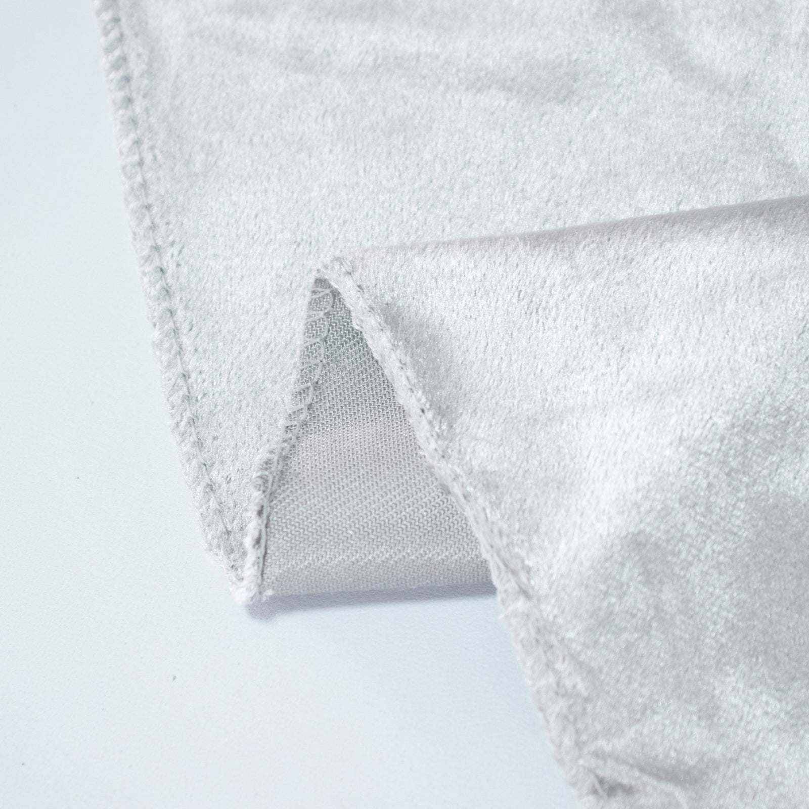 Silver premium velvet round tablecloth corner detail.