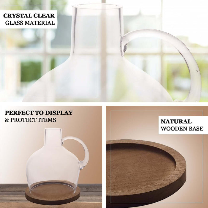 Clear glass vase with wooden base, perfect for candle centerpiece display.