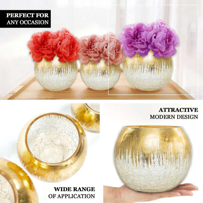 Gold foiled crackle glass bud vase with flowers, perfect for table centerpiece.