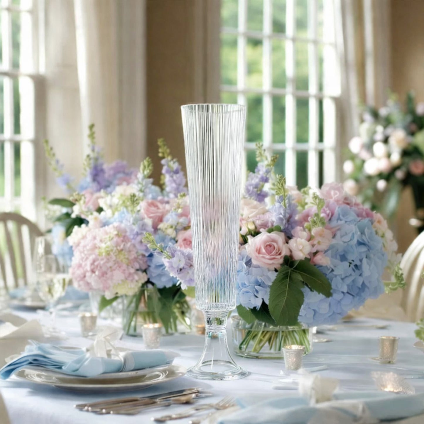 Clear ribbed glass trumpet vases for elegant flower centerpieces.
