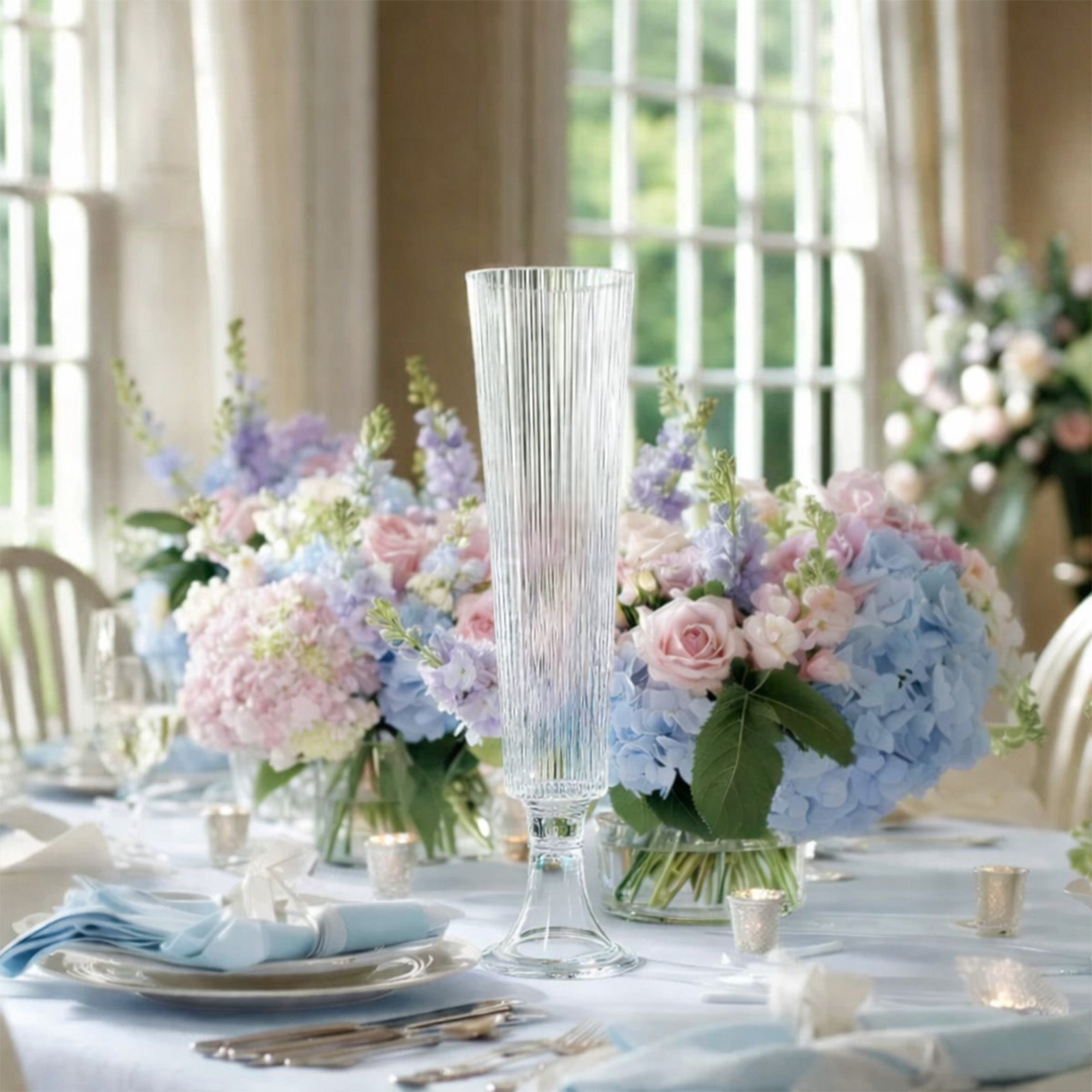 Clear ribbed glass trumpet vases for elegant flower centerpieces.