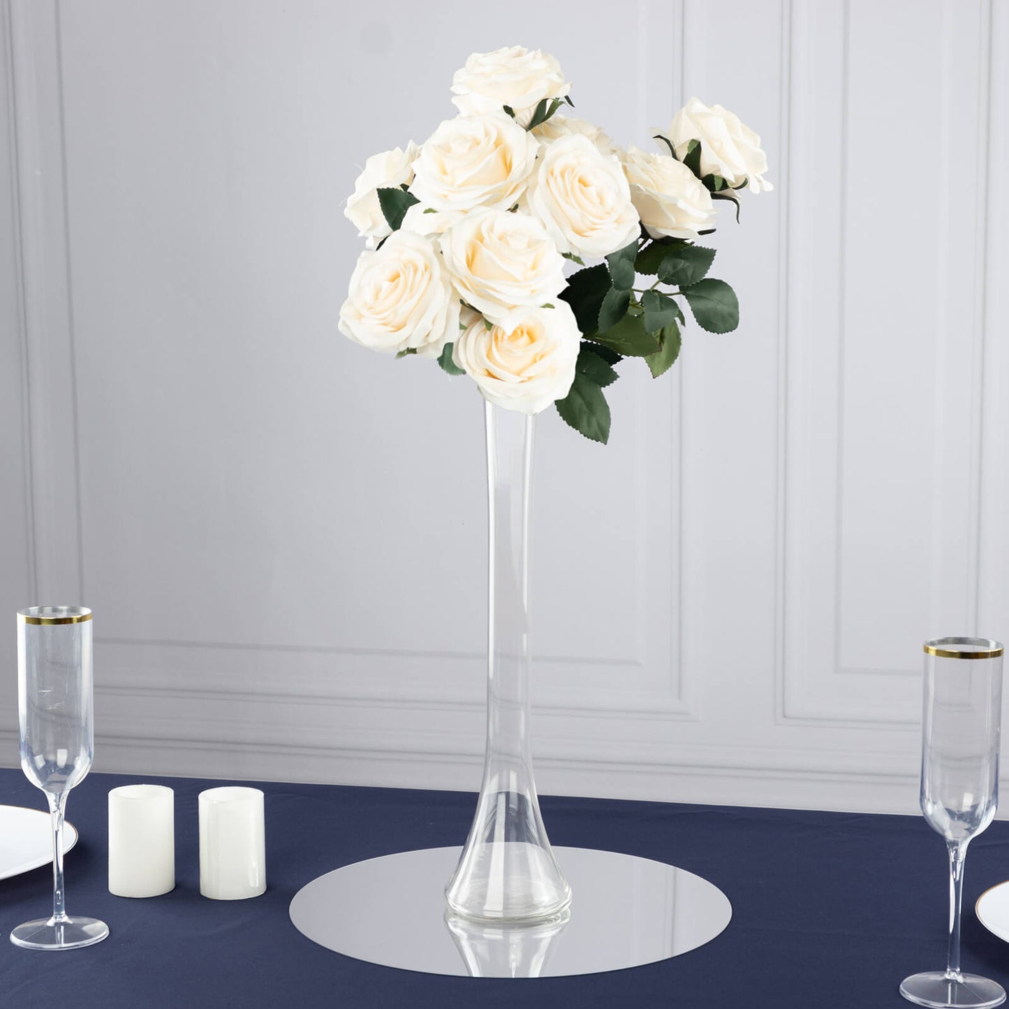 Clear glass Eiffel Tower vase with white roses, 16" tall centerpiece.
