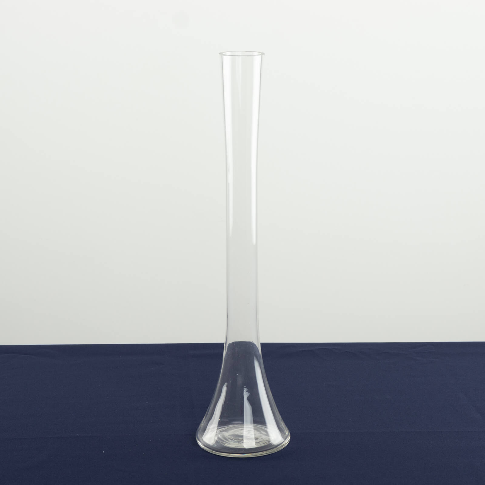 Clear glass Eiffel Tower vase, 16" tall, perfect for flower arrangements.