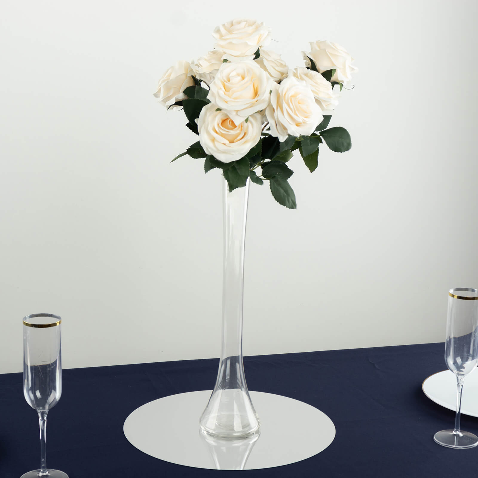 Clear glass Eiffel Tower vase with white roses, 16" tall centerpiece.