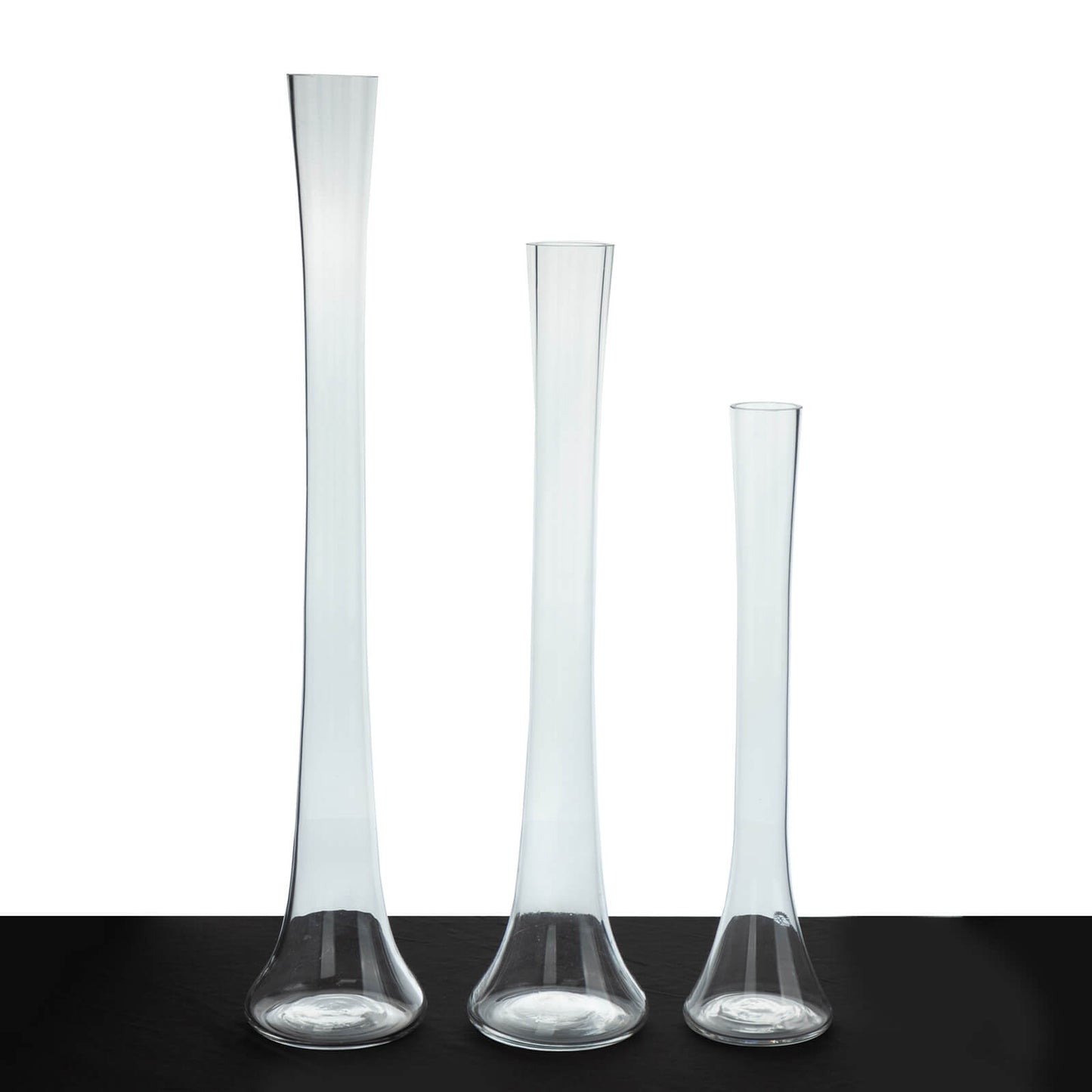 Clear glass Eiffel Tower vases, 16" tall, perfect for flower arrangements.