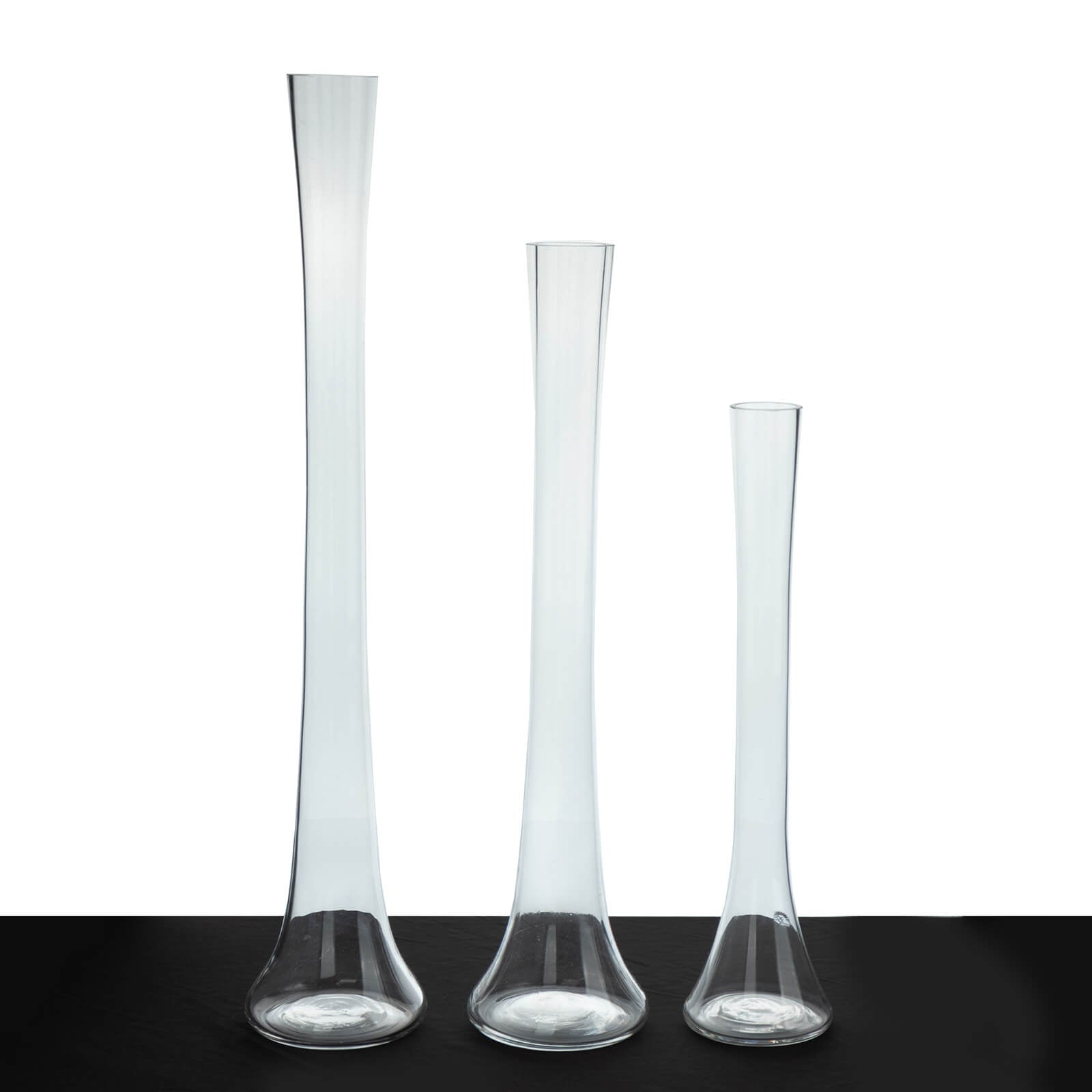 Clear glass Eiffel Tower vases, 16" tall, perfect for flower arrangements.