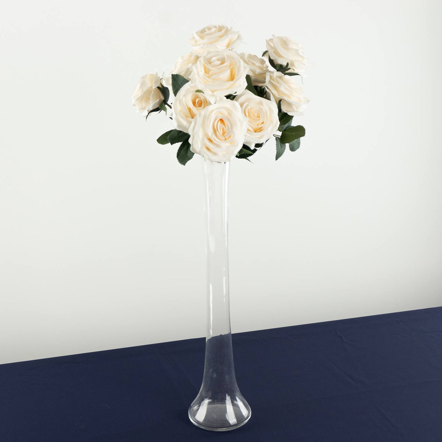 Clear glass Eiffel Tower vase with white roses, 20" tall centerpiece.