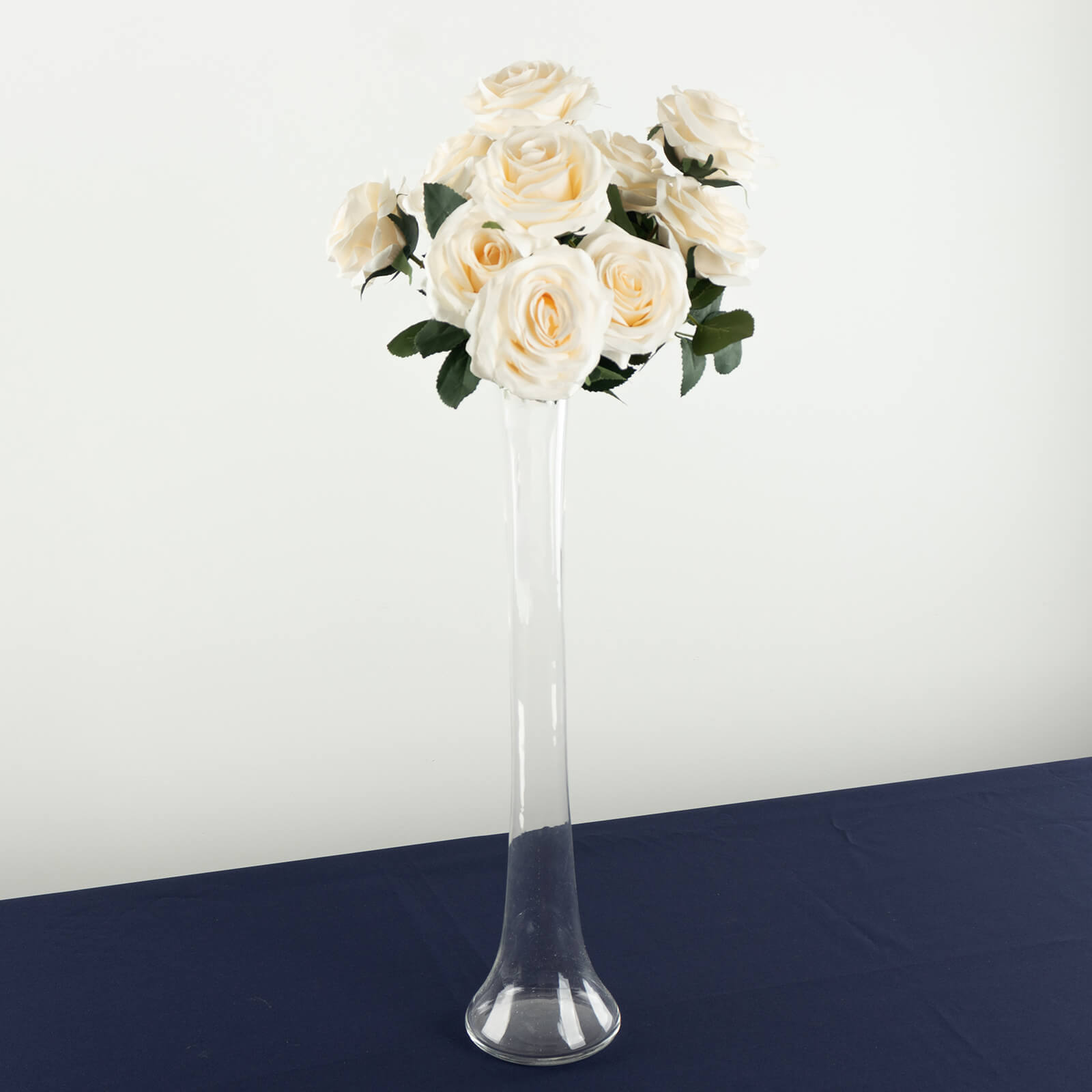 Clear glass Eiffel Tower vase with white roses, 20" tall centerpiece.