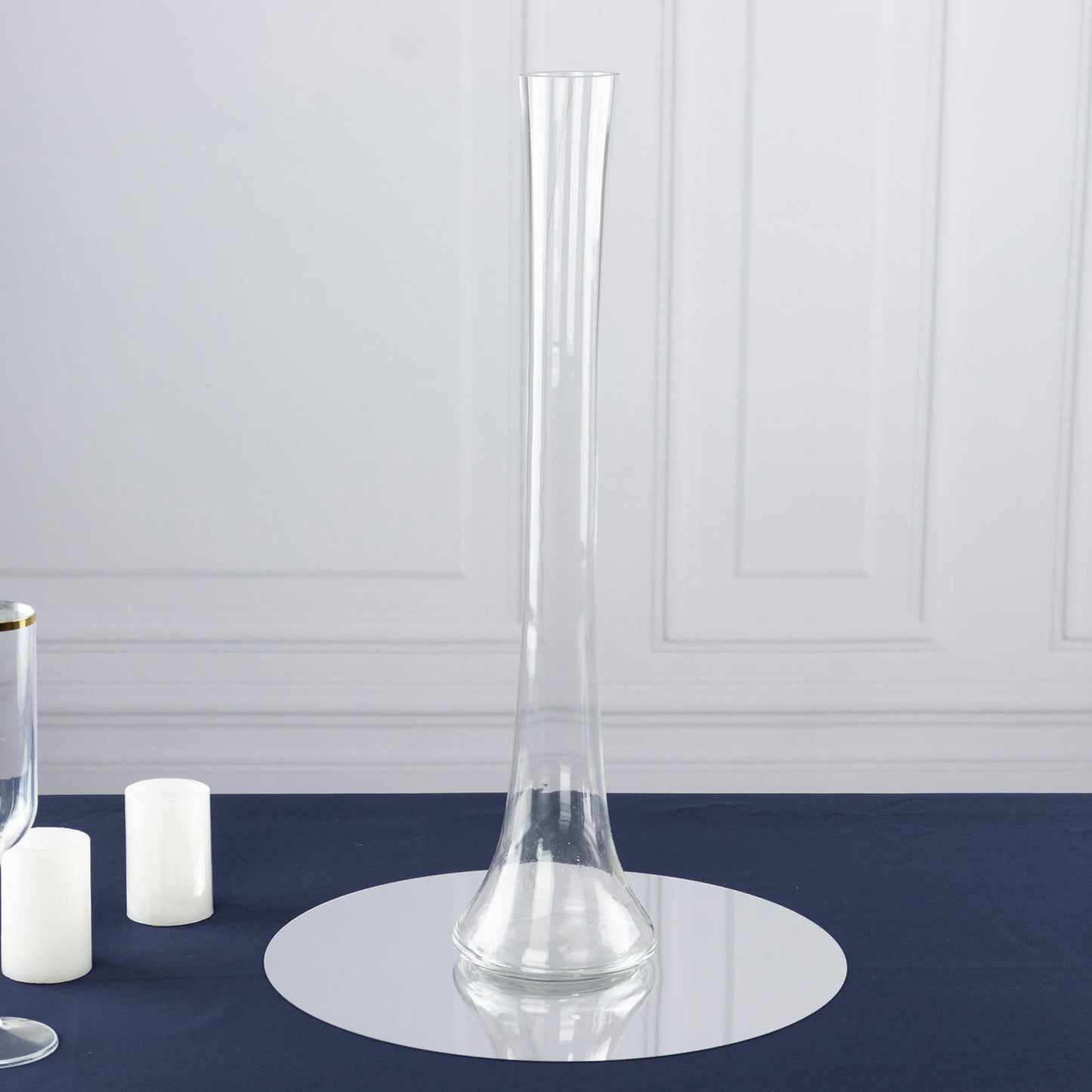 Clear glass Eiffel Tower vase, 20" tall, round base, perfect for centerpieces.