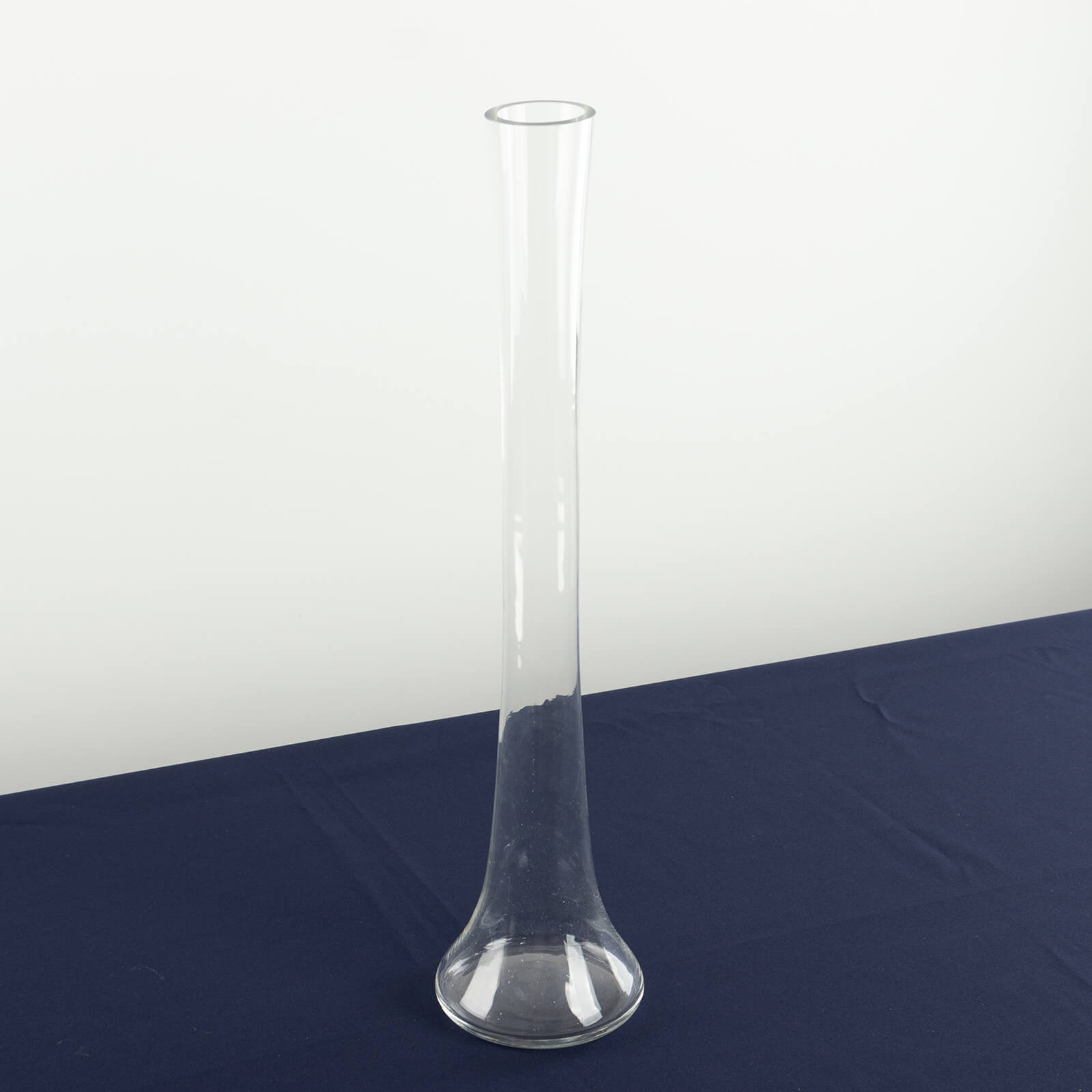 Clear glass Eiffel Tower vase, 20" tall, perfect for flower arrangements.