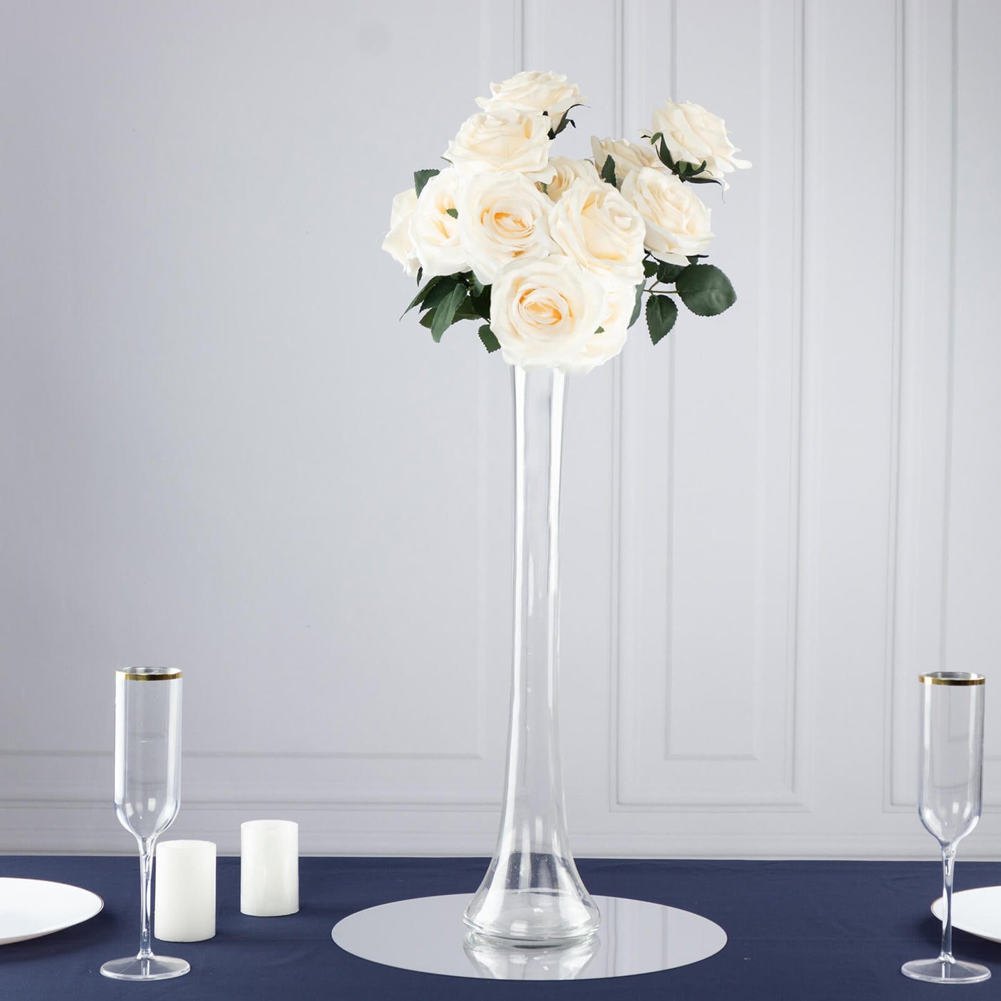 Clear glass Eiffel Tower vase with white roses, 20" tall centerpiece.