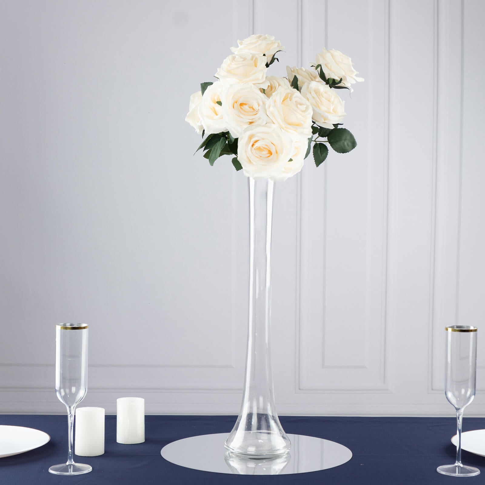 Clear glass Eiffel Tower vase with white roses, 20" tall centerpiece.