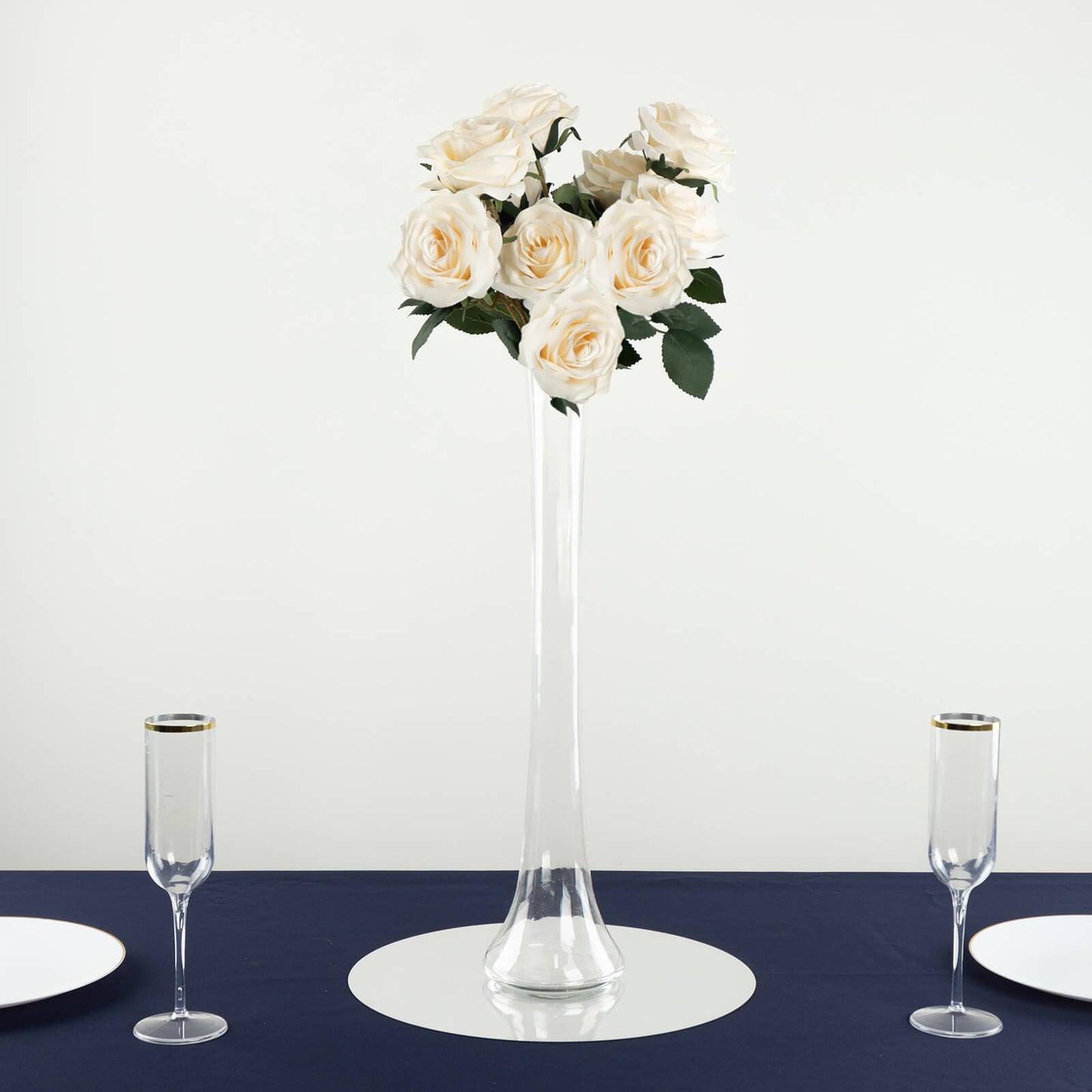 Clear glass Eiffel Tower vase with white roses, 20" tall centerpiece.