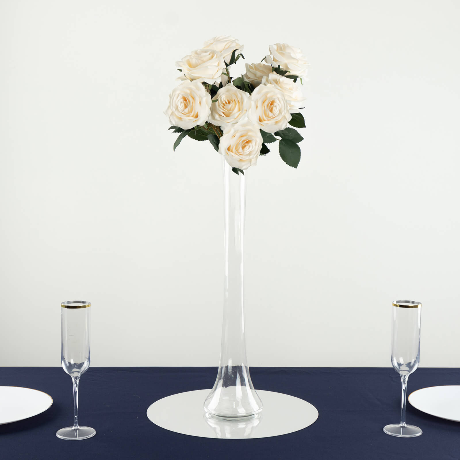 Clear glass Eiffel Tower vase with white roses, 20" tall centerpiece.