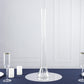 Clear heavy-duty glass Eiffel Tower vase, 24" tall, on a navy blue table setting.