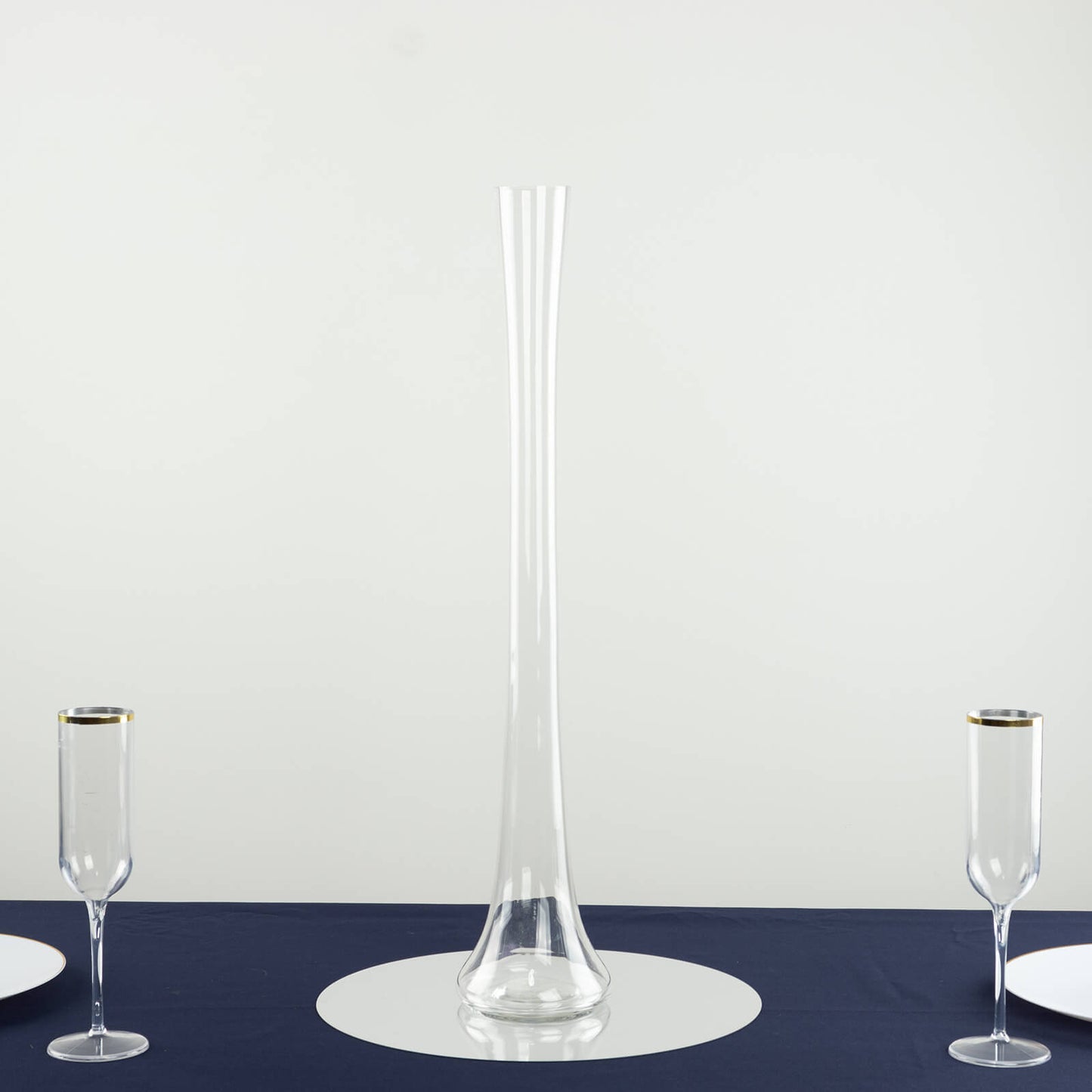 Clear glass Eiffel Tower vase, 24" tall, perfect for flower arrangements.