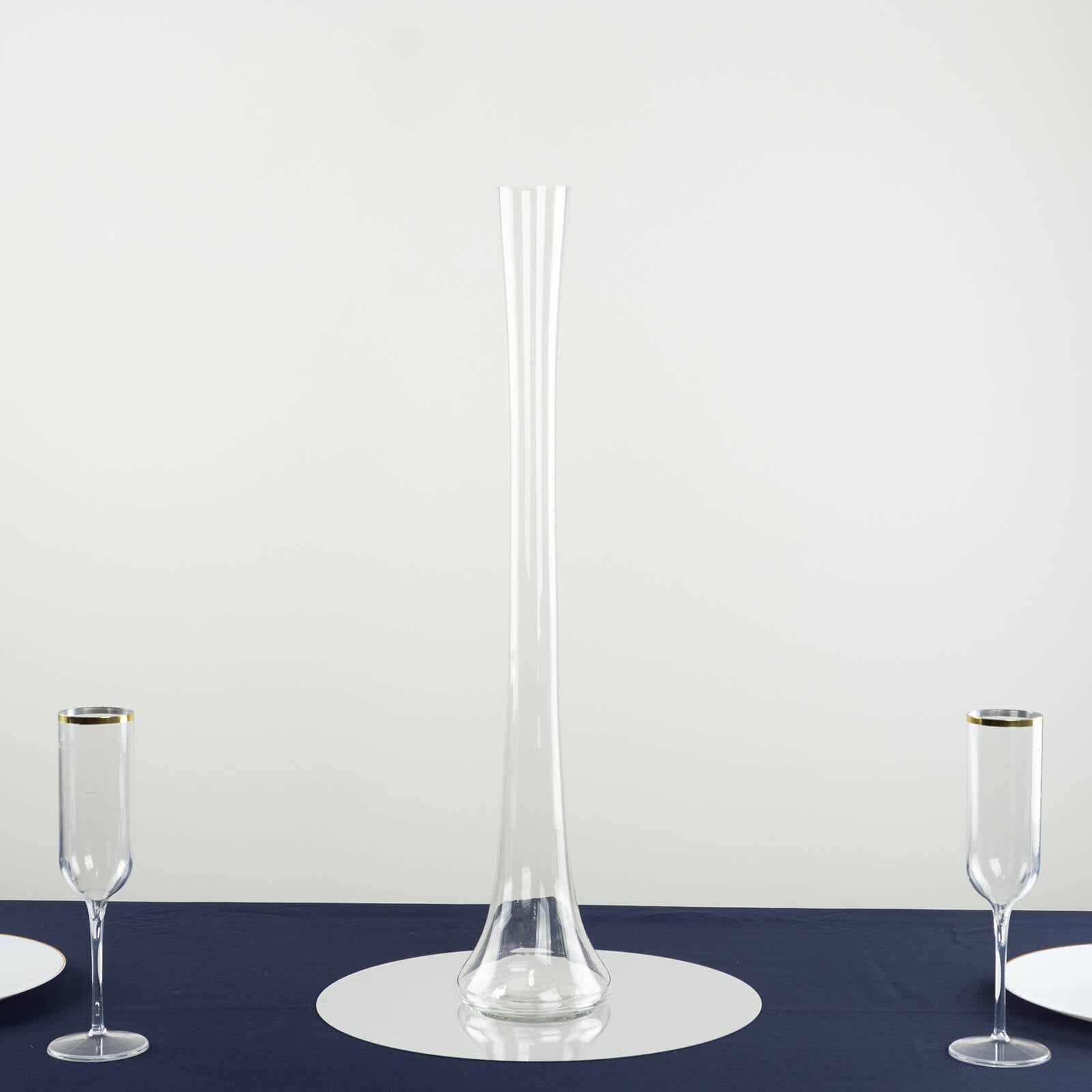 Clear glass Eiffel Tower vase, 24" tall, perfect for flower arrangements.