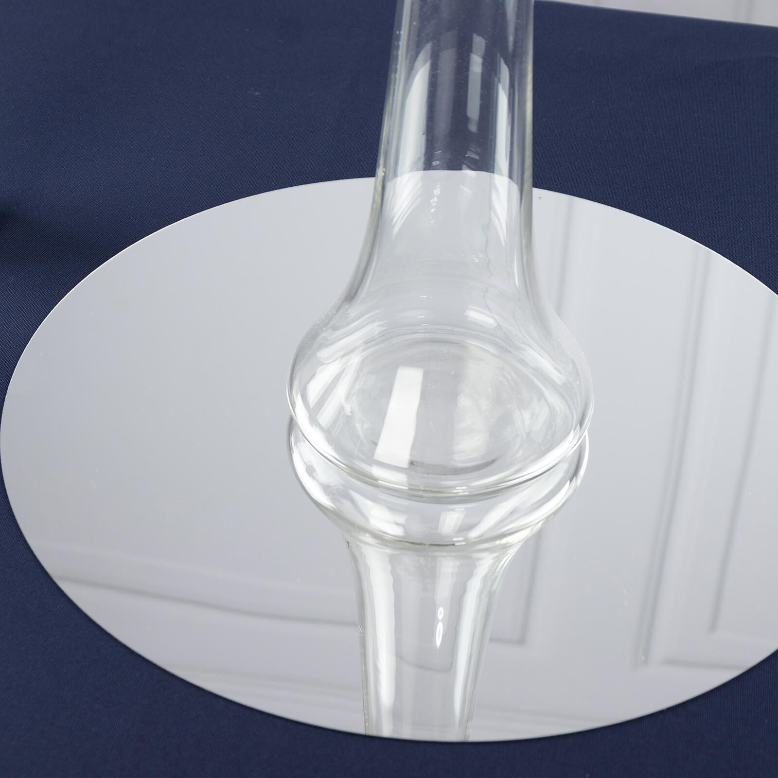 Clear glass Eiffel Tower vase on a round base, 24" tall.