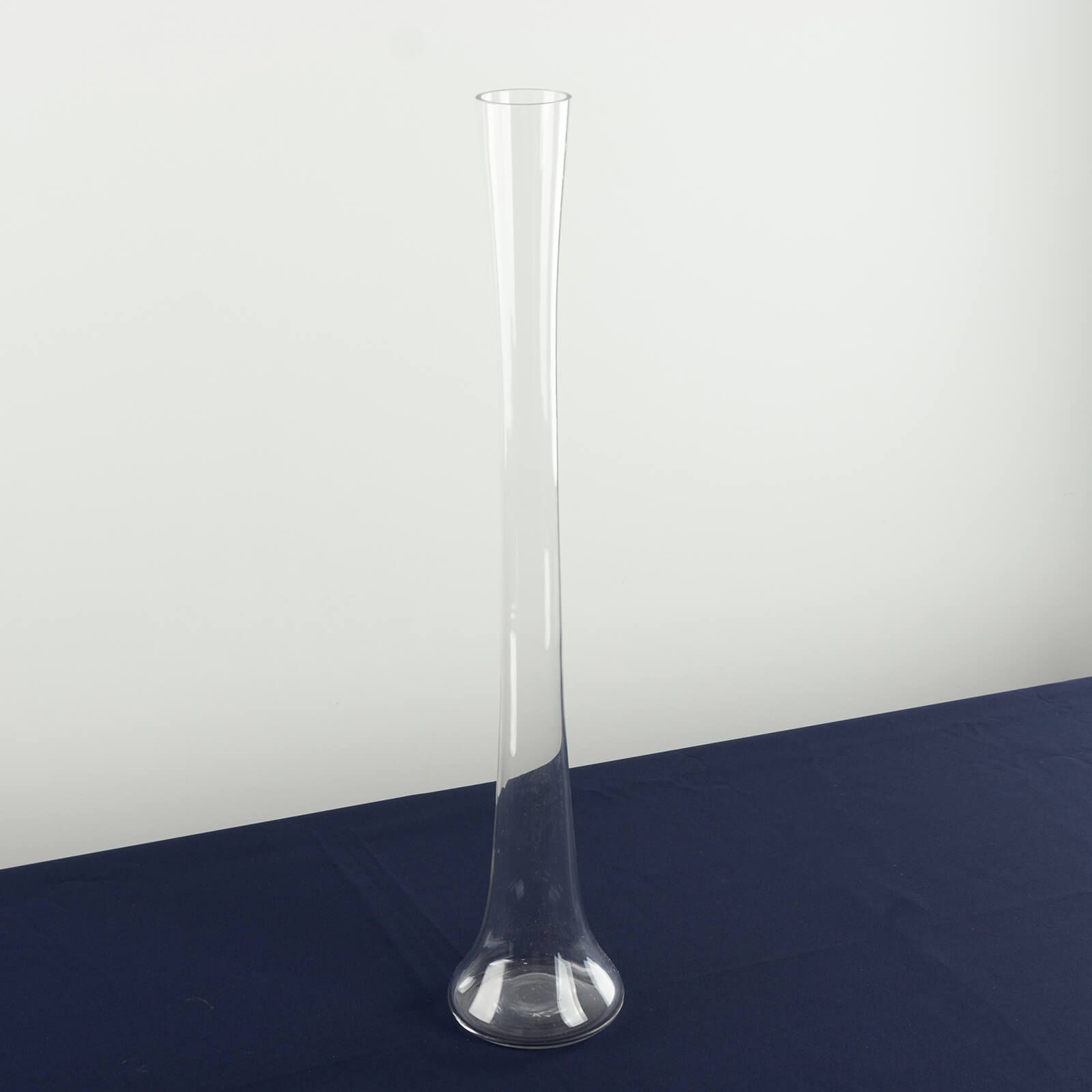 Clear glass Eiffel Tower vase, 24" tall, perfect for flower arrangements.
