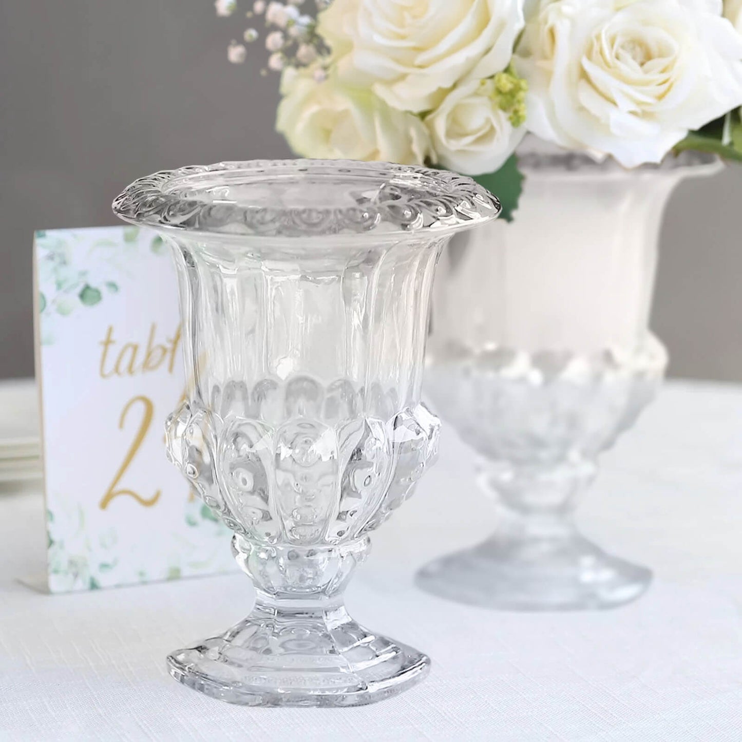 2 Pack Clear Glass Pedestal Flower Vases in Classic Roman Urn Style, 8" Mini Floral Vase Table Centerpieces