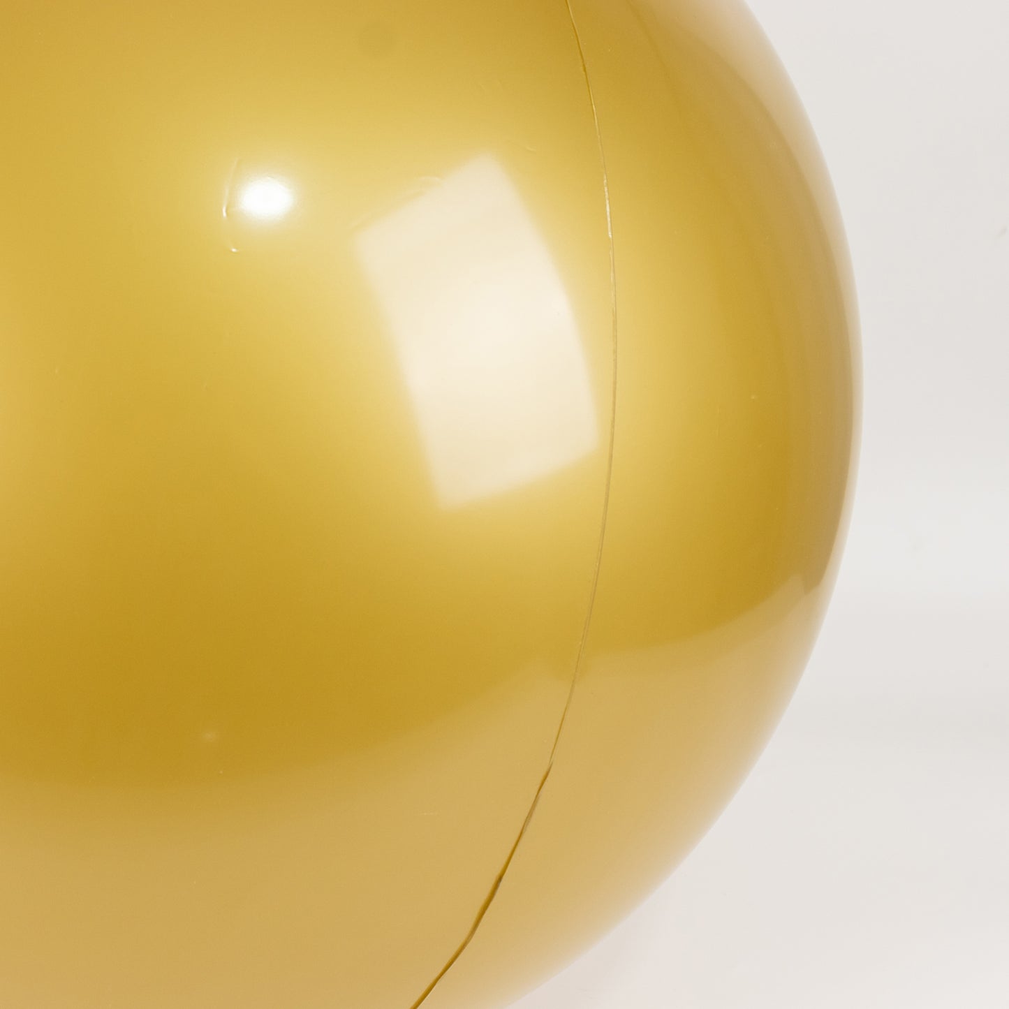 Gold inflatable decorative ball, perfect for pool and party fun.