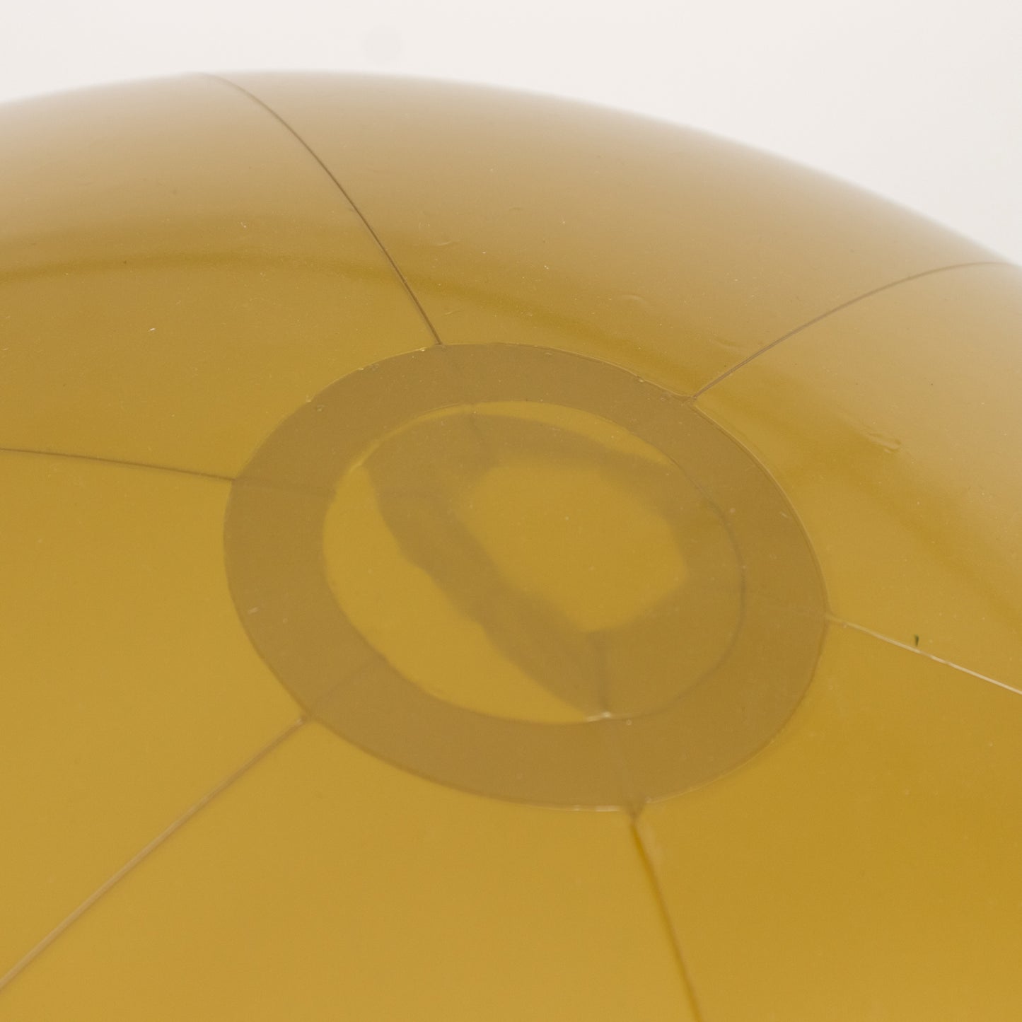 Inflatable gold decorative ball for pool and party fun.