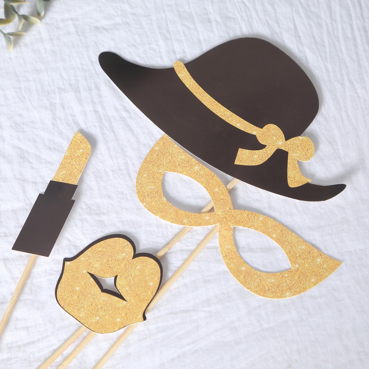 Vintage black and gold glitter party photo booth props for fun celebrations.