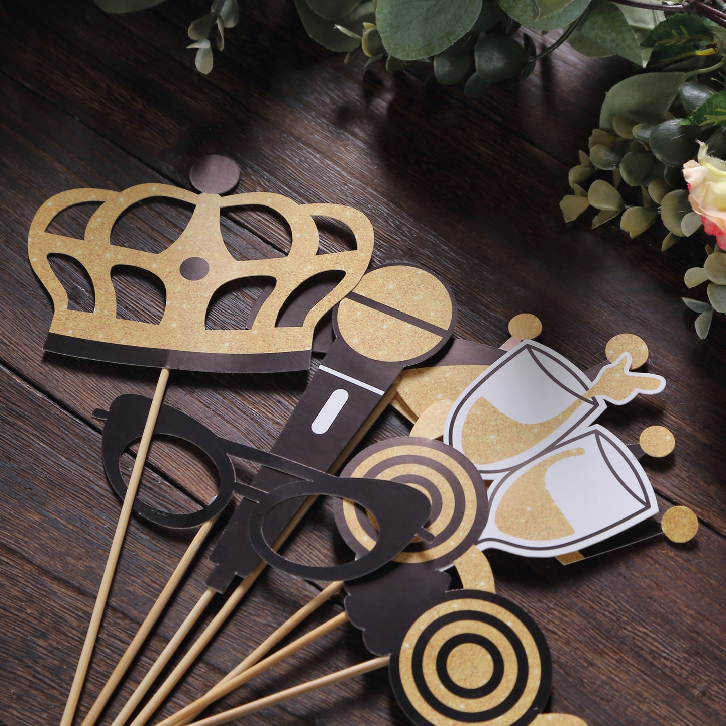Vintage black and gold glitter photo booth props for parties.