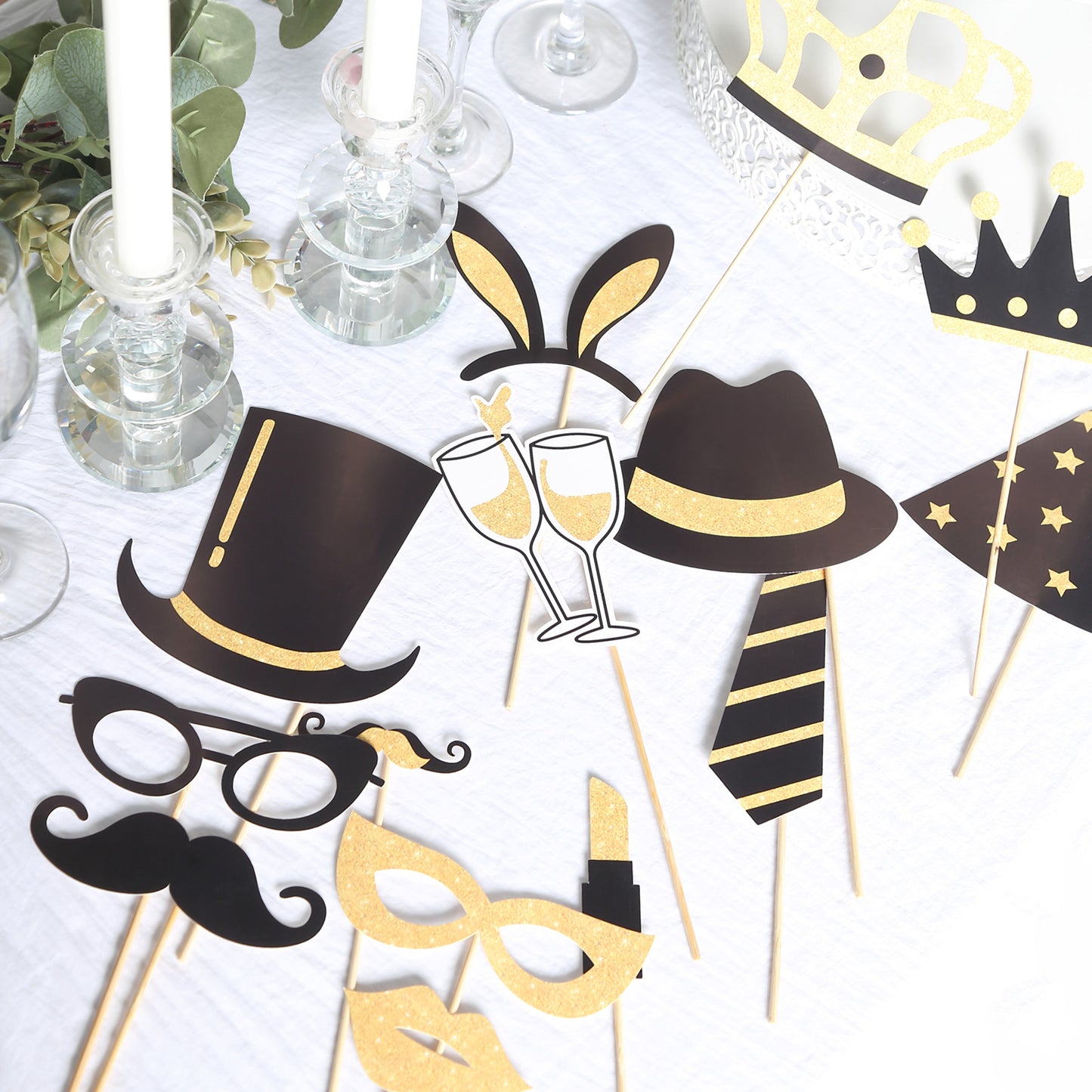 Vintage black and gold glitter photo booth props for parties.