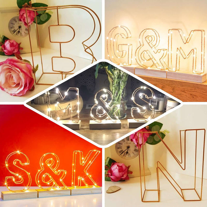 Gold decorative wire letter centerpiece for weddings, 8 inches tall.