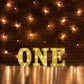 Gold 3D marquee letter "O" with warm white LED lights.