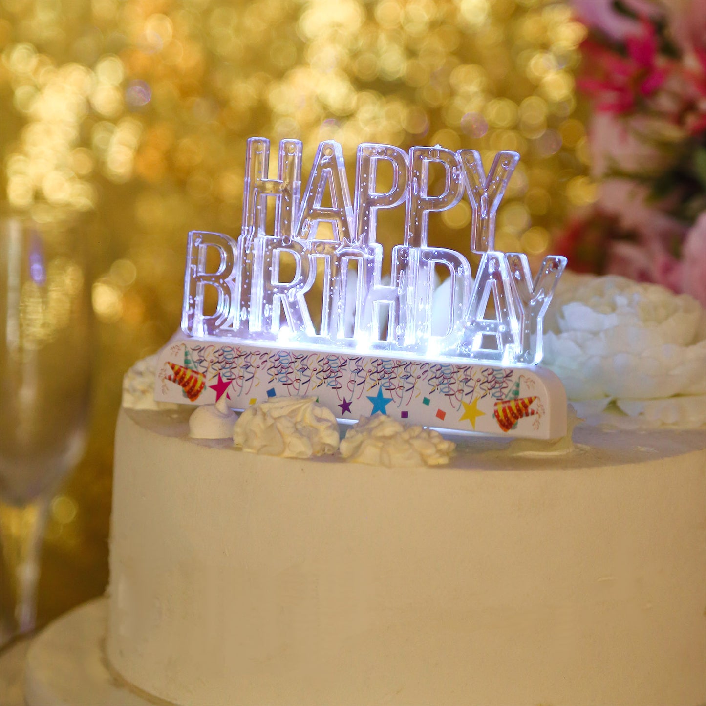 Clear acrylic multicolor flashing LED Happy Birthday cake topper on a cake.