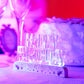 Clear acrylic multicolor flashing LED birthday cake topper.