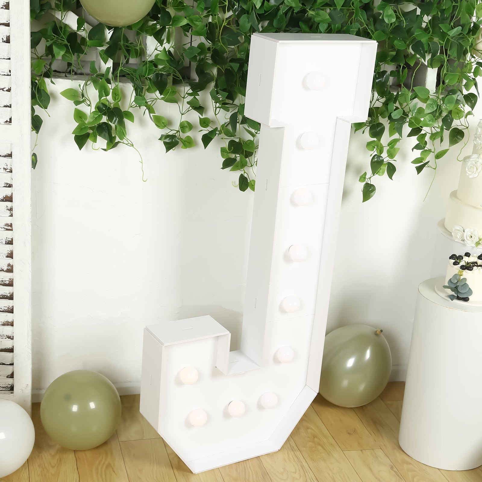 White LED marquee letter "J" with warm white lights.