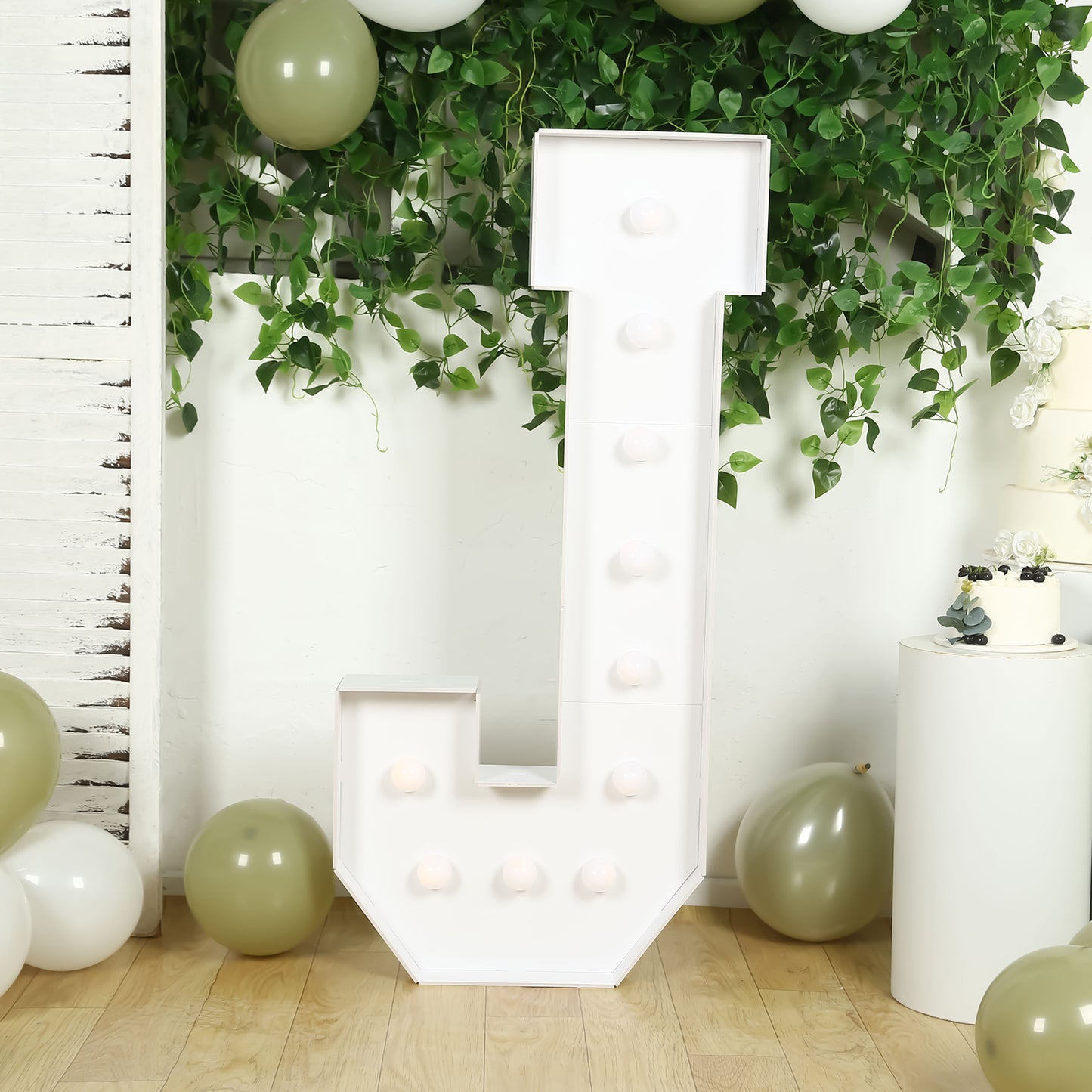 White LED marquee light up letter "J" with warm white lights.