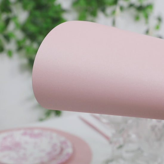 Pink disposable paper placemats for dining tables, 13-inch round, 50 pack.