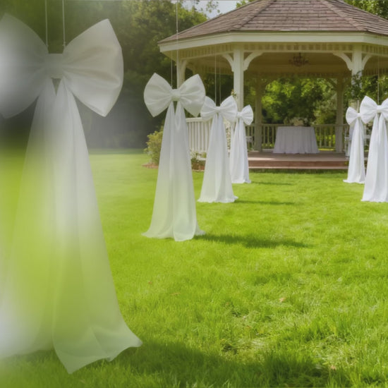 Giant white bow tie décor for wedding and event backdrops.