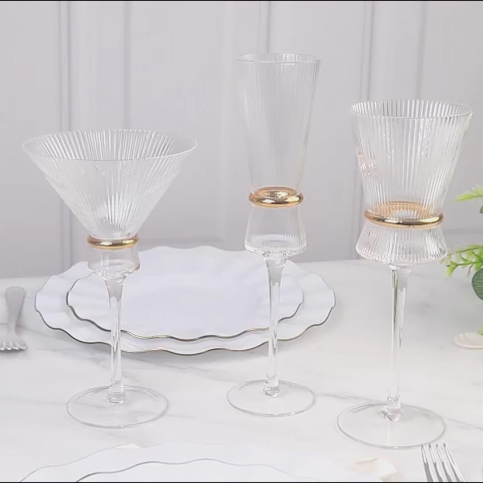 Clear champagne flutes with gold ring accents for elegant celebrations.