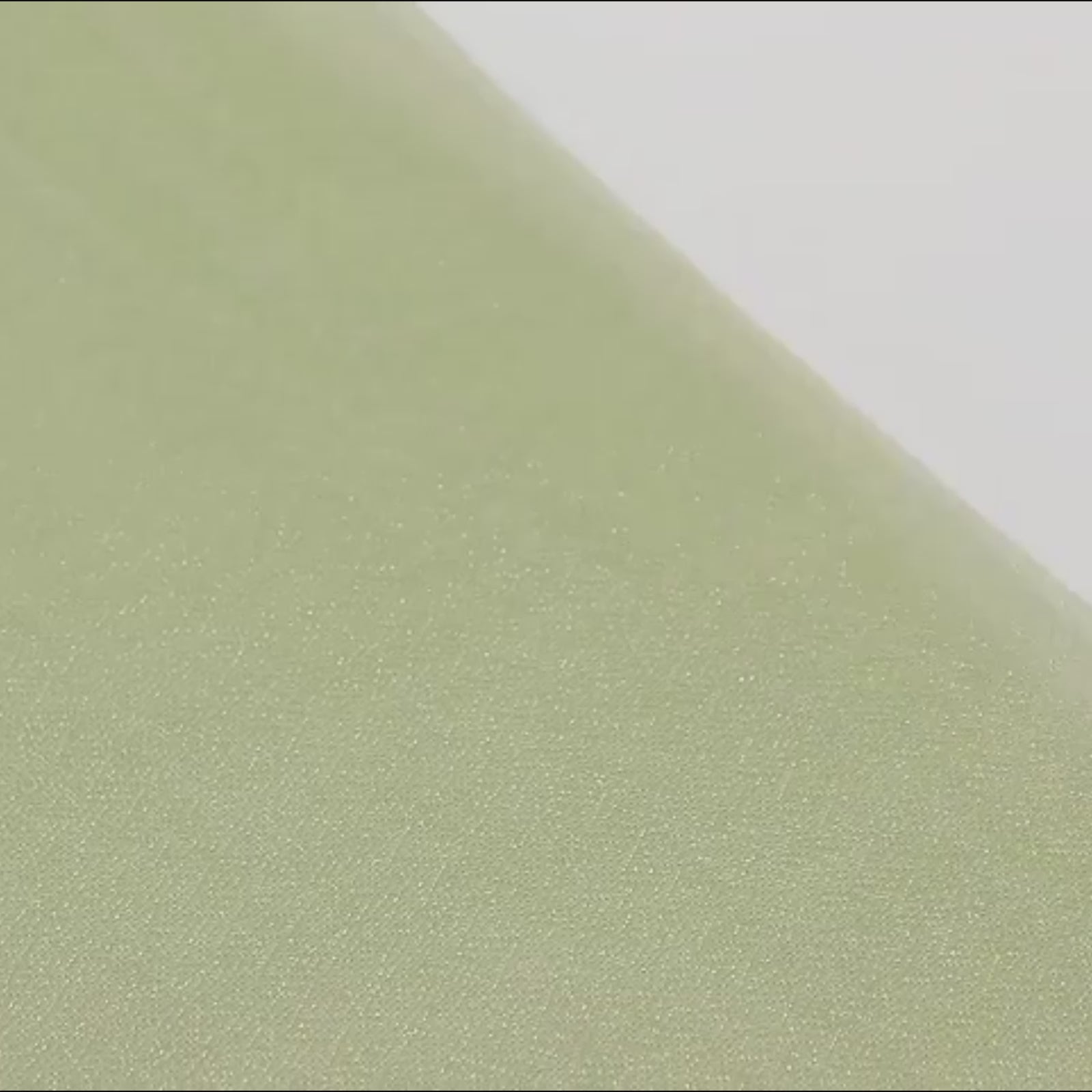 Dusty sage green sheer table runner with shimmer finish.